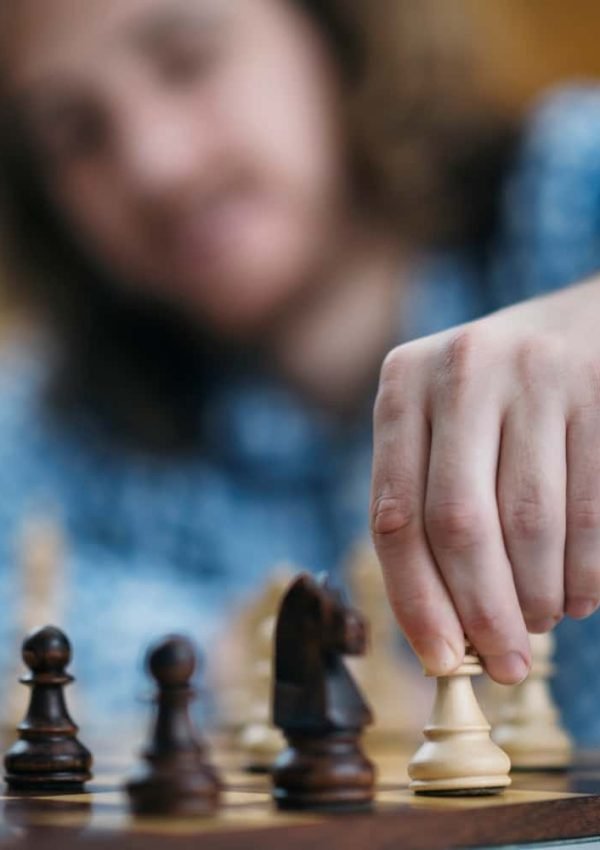 hand-of-chess-player-moving-the-chess-piece-2021-08-27-19-36-56-utc-min.jpg