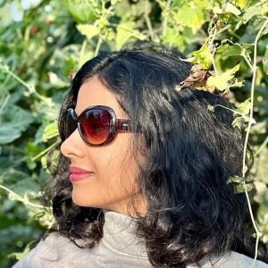 Fashionable girl in nature with sunglasses